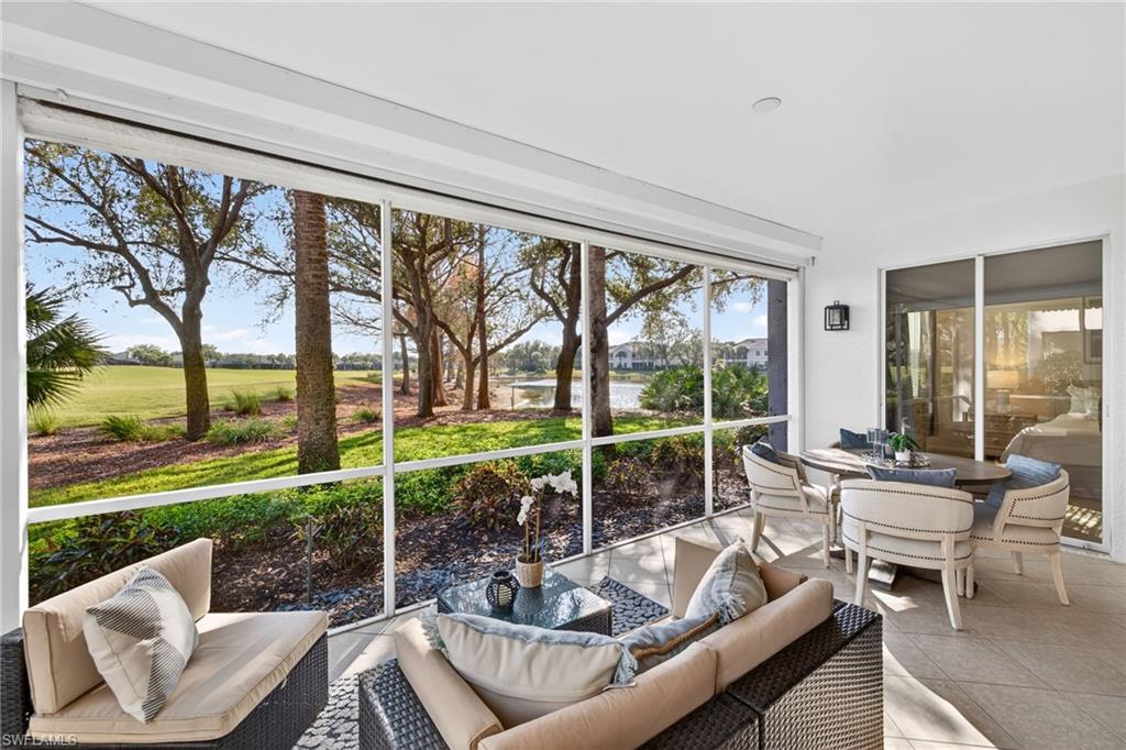9201 Palmetto Ridge Drive, Unit 101 Estero, FL 34135 - Photo 21 of 29 Sunroom featuring outdoor lounge area and view of golf course