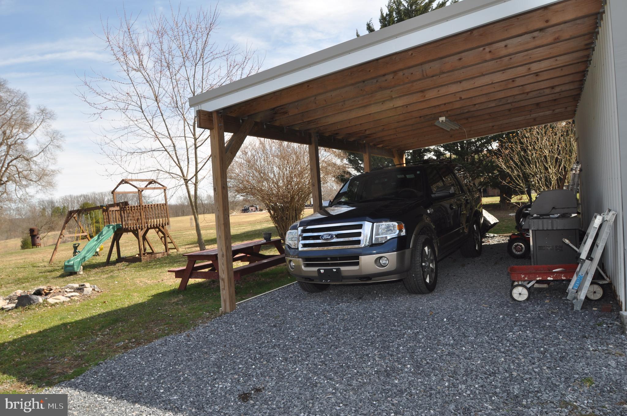 690 Georgetown Road Littlestown, PA 17340 - Photo 28 of 32 Carport off of left side of garage.