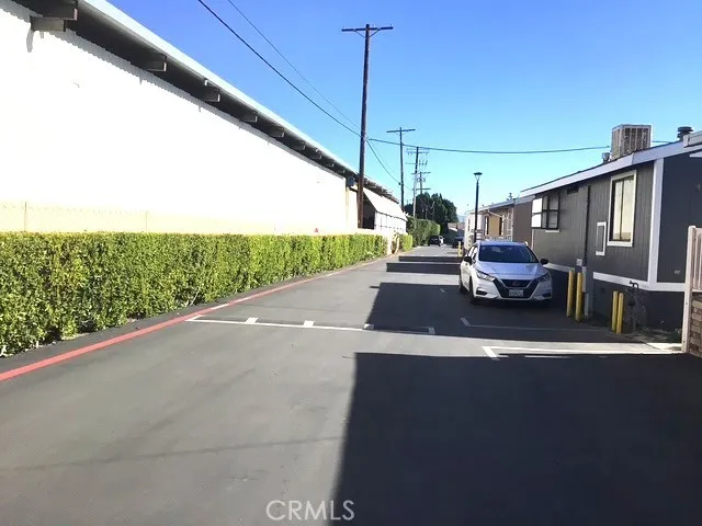 a view of a porch with furniture and a yard