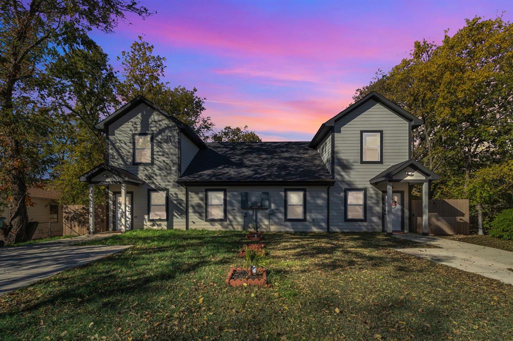 a front view of a house with a yard