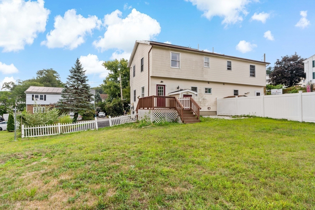 45 Fourth Street, Unit RIGHT Worcester, MA 01602 - Photo 19 of 21 a front view of a house with garden