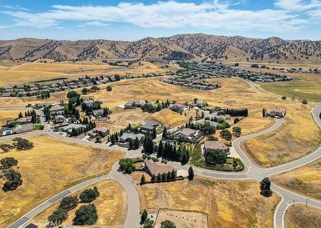 an aerial view of residential building and ocean view