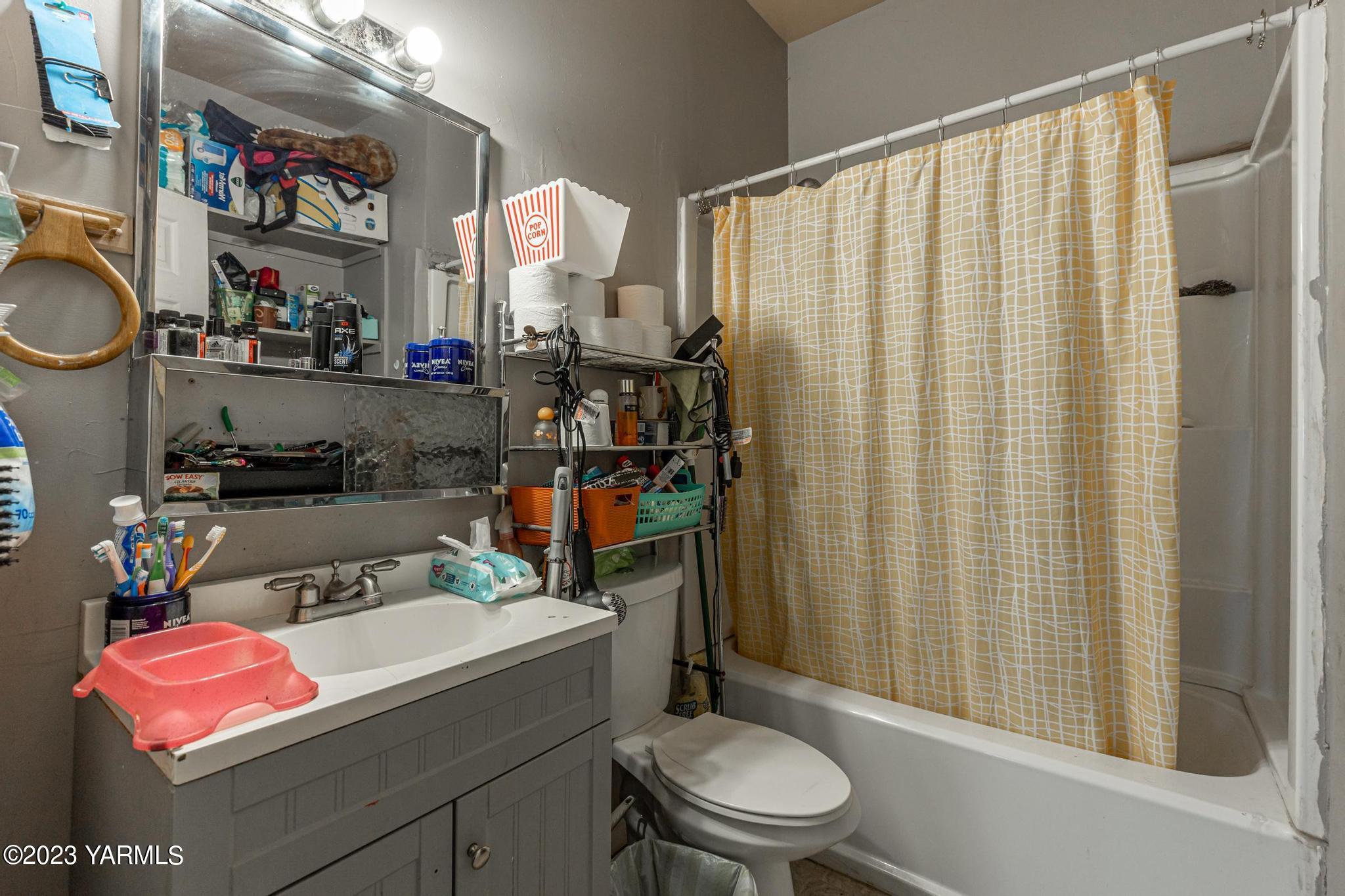 131 Ogle Road Grandview, WA 98930 - Photo 11 of 41 a bathroom with a sink toilet and shower