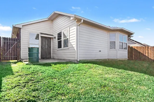 a view of a backyard of the house