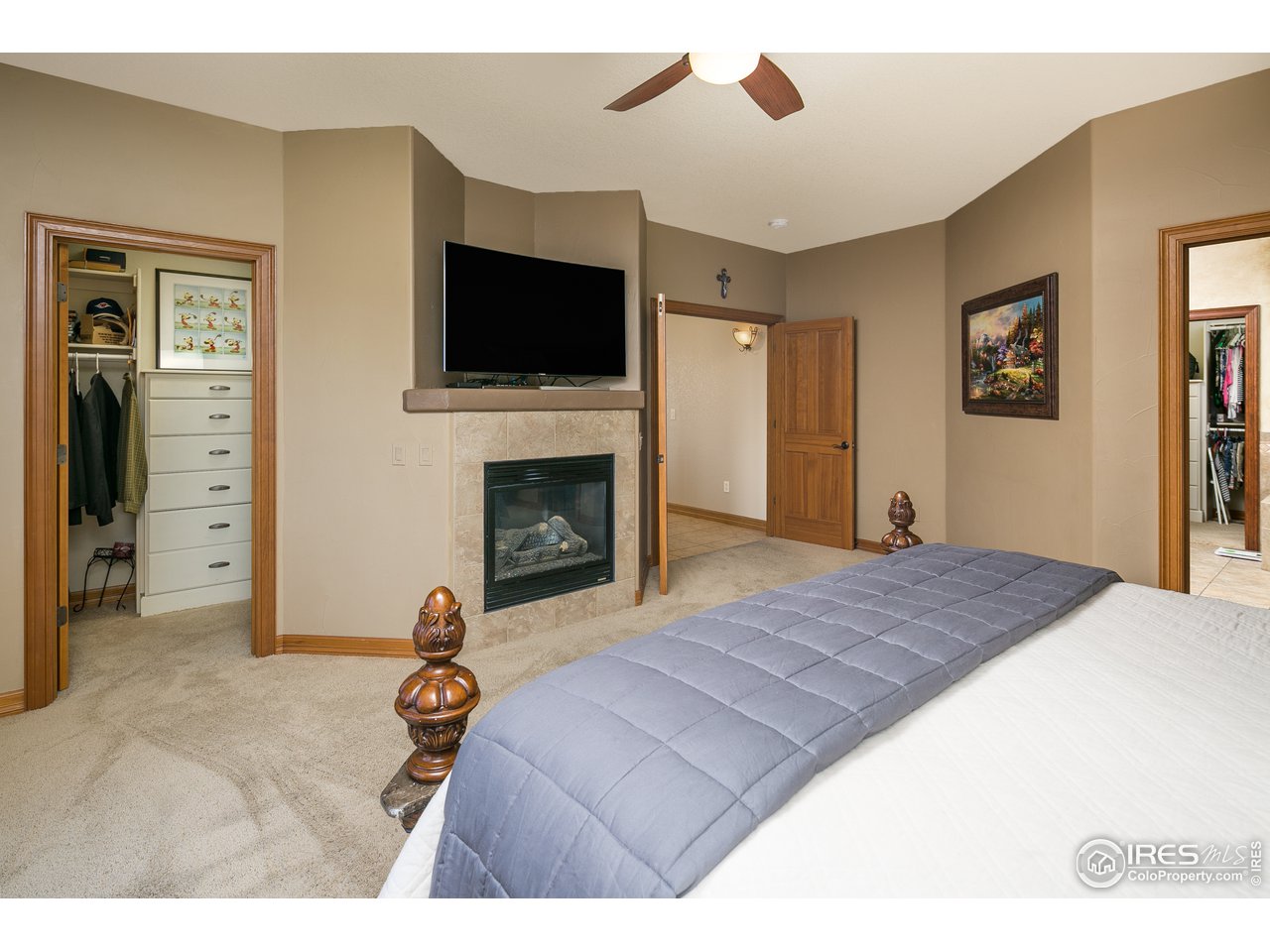 7507 Plateau Road Greeley, CO 80634 - Photo 13 of 35 Master Suite w/ Gas Fireplace + Dual Walk-In Closets