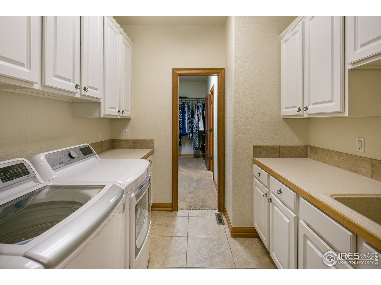 7507 Plateau Road Greeley, CO 80634 - Photo 19 of 35 Main Floor Laundry w/ Lots of storage + laundry tub
