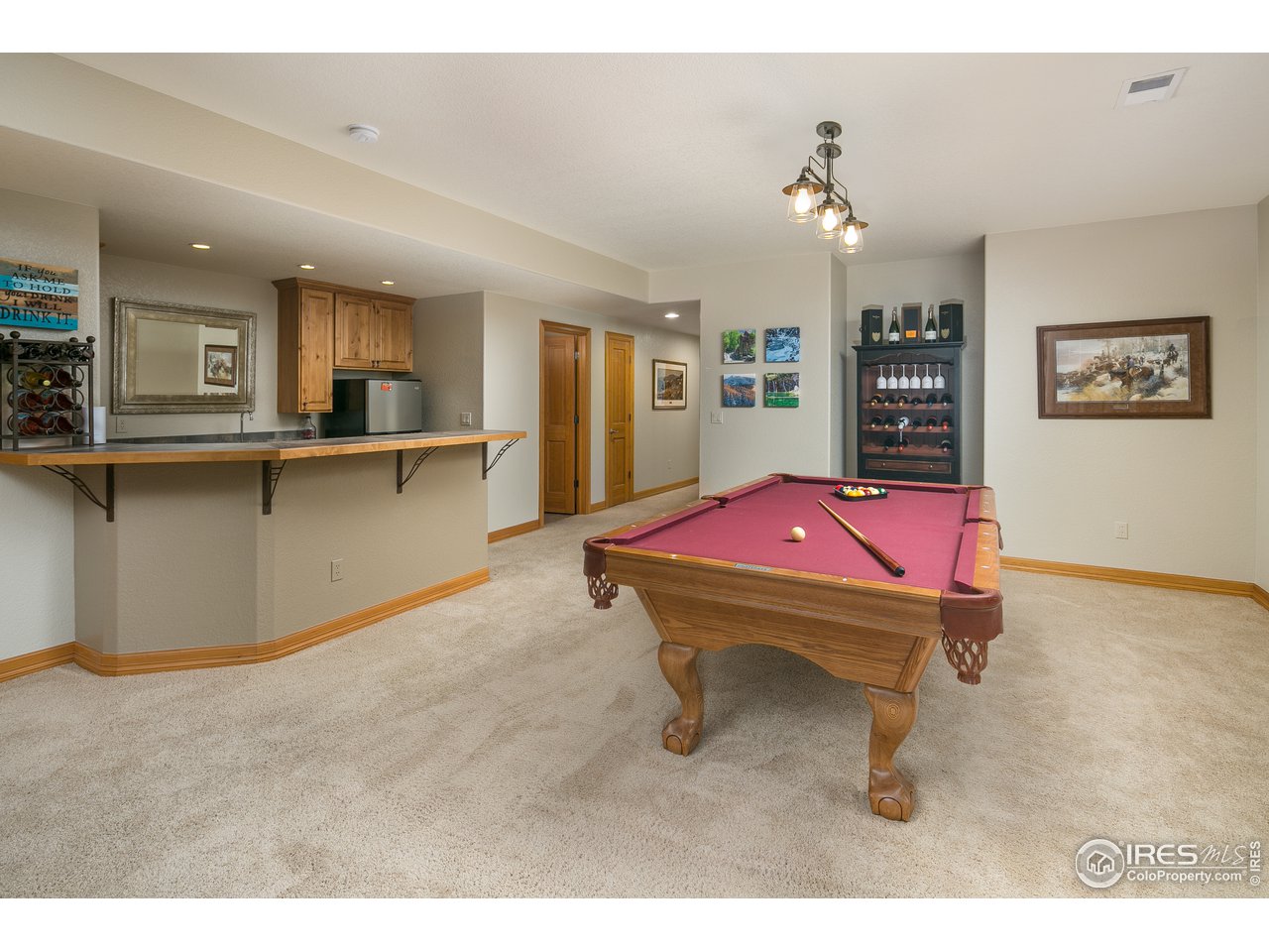 7507 Plateau Road Greeley, CO 80634 - Photo 20 of 35 Lower Level Game Area + Wet Bar