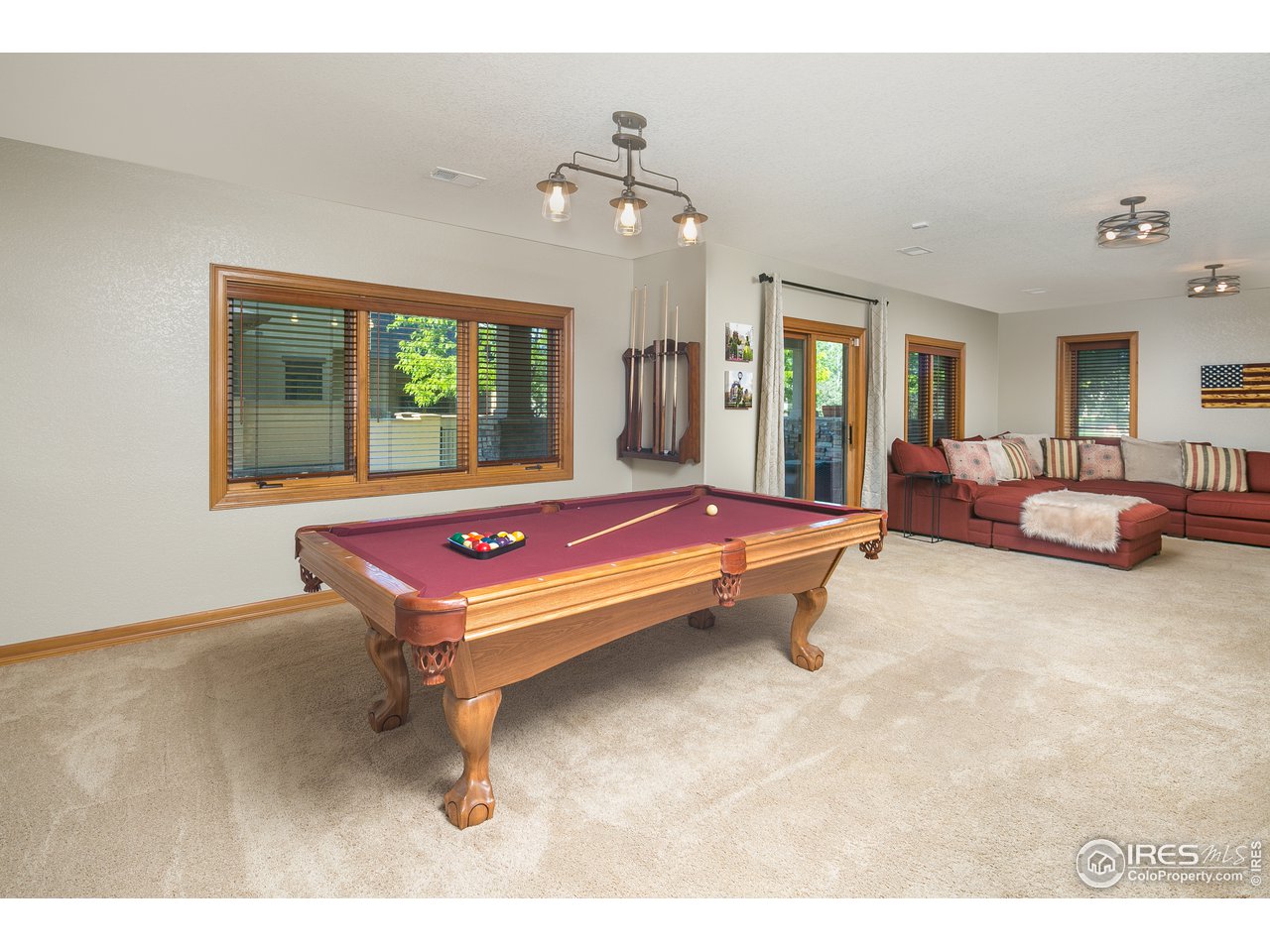 7507 Plateau Road Greeley, CO 80634 - Photo 21 of 35 Lower Level Game Area w/ Access to covered patio