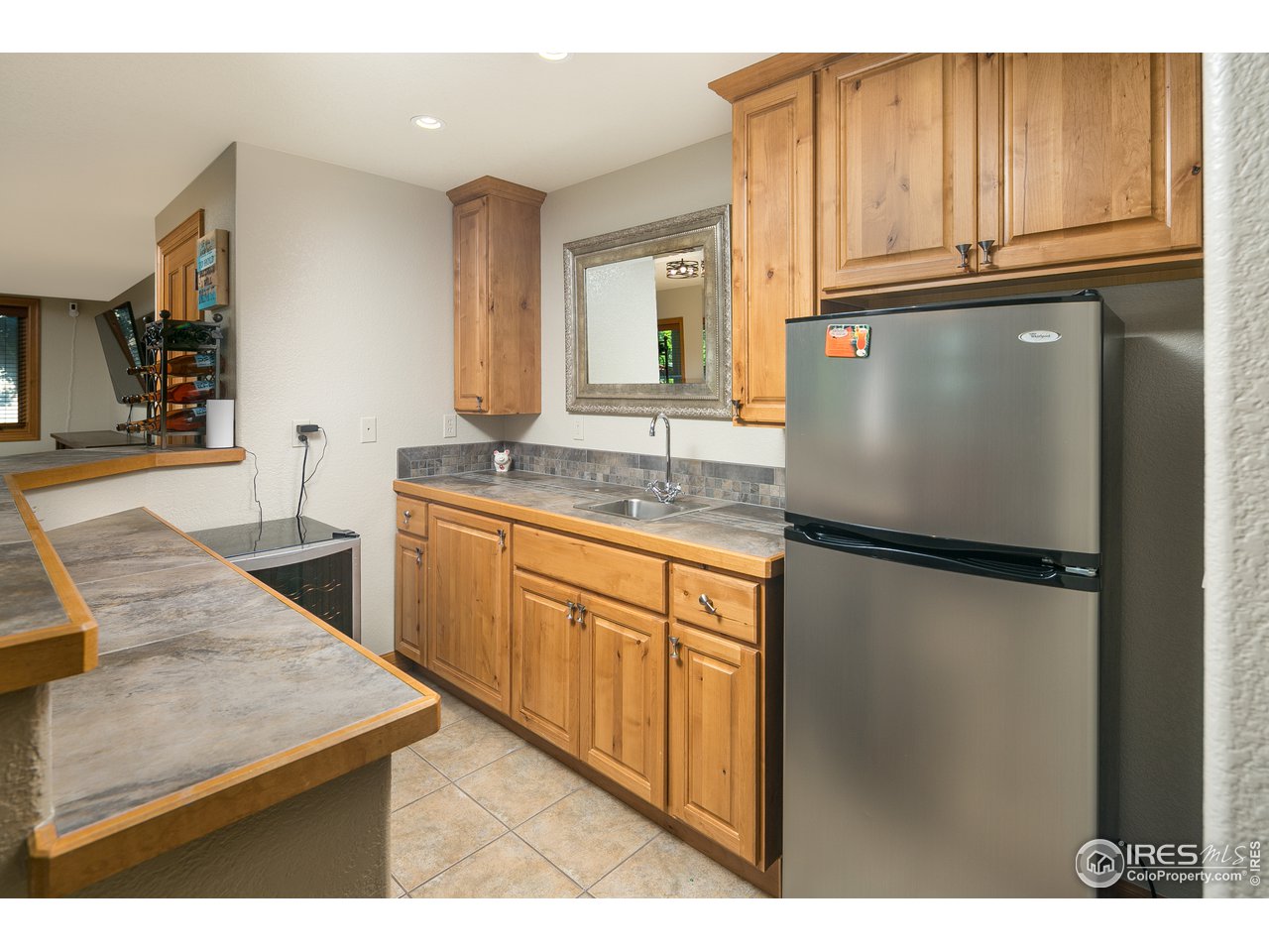7507 Plateau Road Greeley, CO 80634 - Photo 22 of 35 Custom Wet Bar