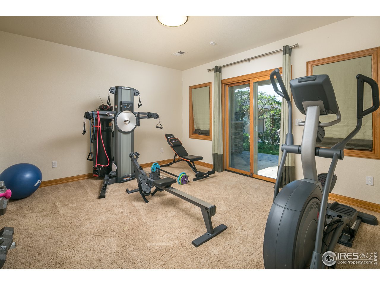 7507 Plateau Road Greeley, CO 80634 - Photo 26 of 35 Lower Level Bedroom 4 w/ Patio Access + Jack-N-Jill Bath
