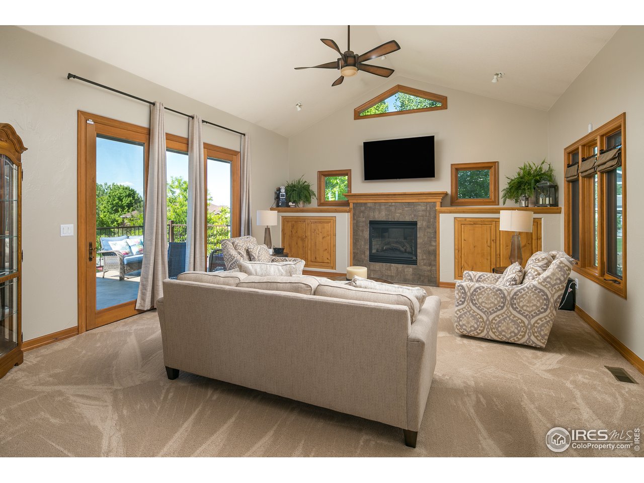 7507 Plateau Road Greeley, CO 80634 - Photo 3 of 35 Spacious living room w/ Gas Fireplace & Built-Ins