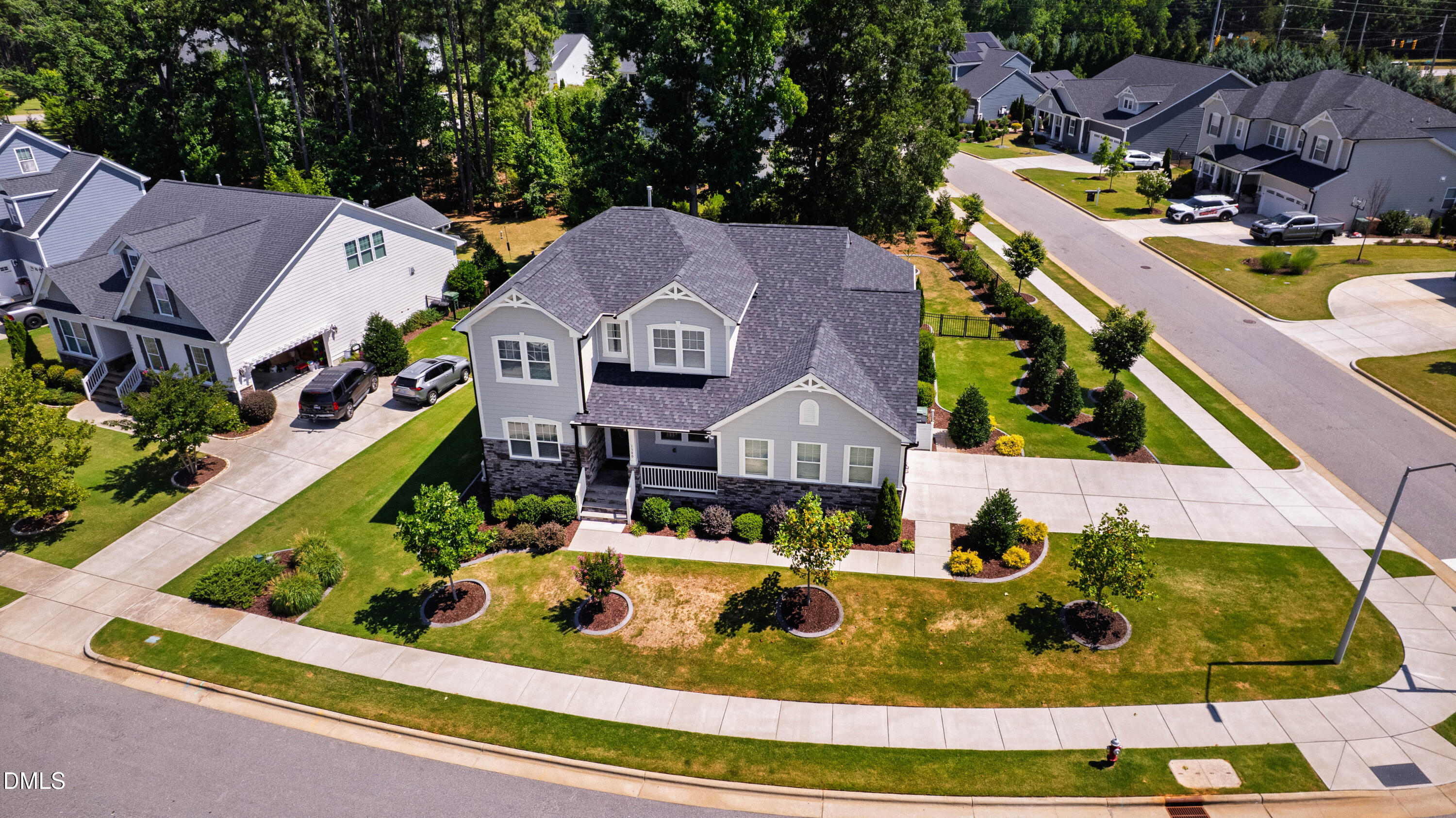 1300 Commons Ford Place Apex, NC 27539 - Photo 67 of 70 an aerial view of a house with swimming pool and a yard