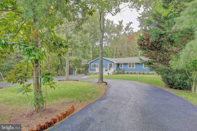 a view of a house with a small yard