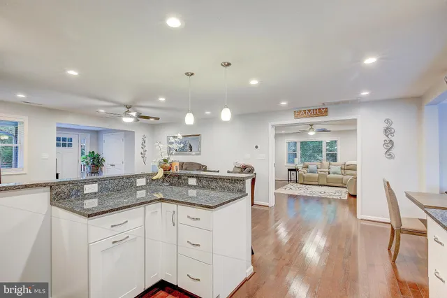 a kitchen with a sink and living room