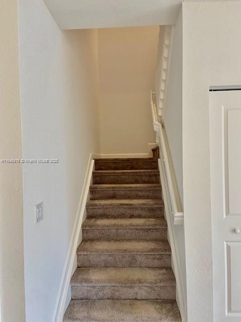 20626 Northeast 5th Place, Unit 20626 Miami, FL 33179 - Photo 12 of 34 a view of staircase with white walls