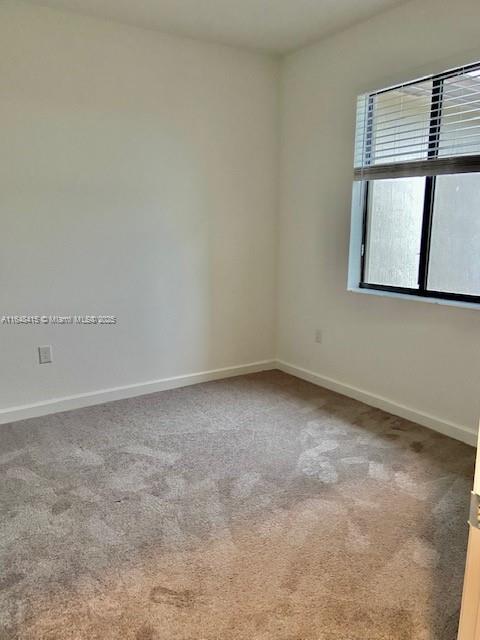 20626 Northeast 5th Place, Unit 20626 Miami, FL 33179 - Photo 16 of 34 a view of an empty room with a window