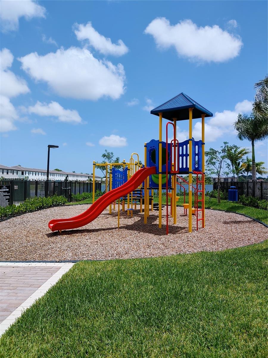 20626 Northeast 5th Place, Unit 20626 Miami, FL 33179 - Photo 25 of 34 a view of park with slide and bench