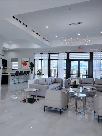 a living room with furniture gym and a large window