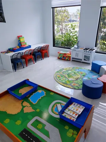 a view of a swimming pool with a table and chairs
