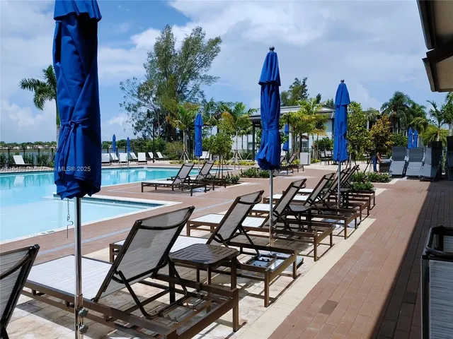 a view of a swimming pool with a patio