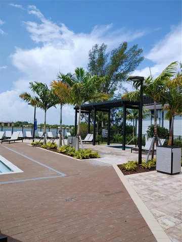 a view of a patio with a table and chairs
