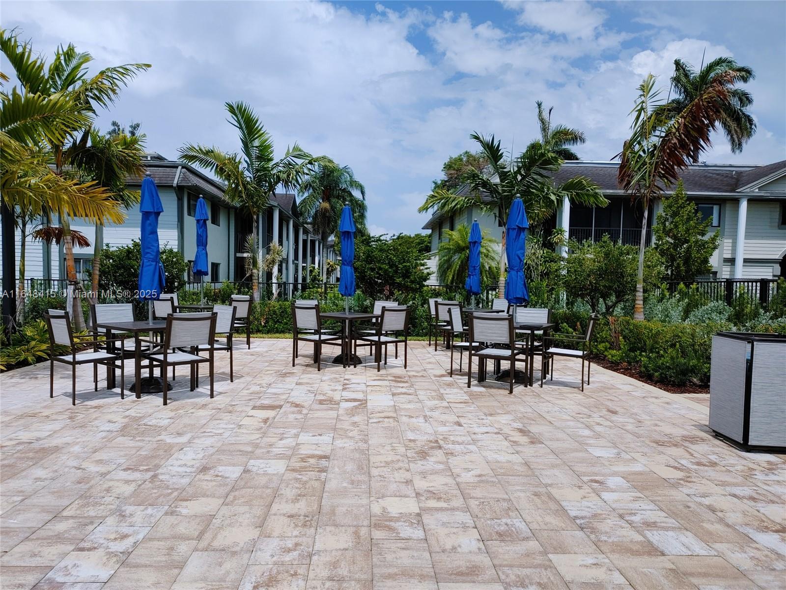 20626 Northeast 5th Place, Unit 20626 Miami, FL 33179 - Photo 34 of 34 a view of a patio with a table and chairs