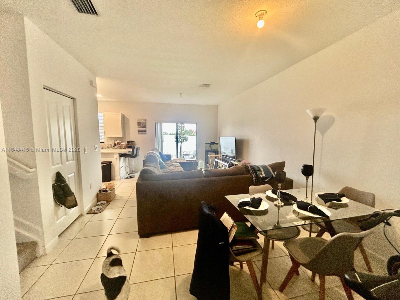 20626 Northeast 5th Place, Unit 20626 Miami, FL 33179 - Photo 4 of 34 a view of a dining room with furniture