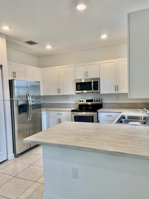 20626 Northeast 5th Place, Unit 20626 Miami, FL 33179 - Photo 5 of 34 a kitchen with stainless steel appliances a refrigerator sink and microwave