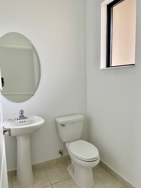 20626 Northeast 5th Place, Unit 20626 Miami, FL 33179 - Photo 9 of 34 a white toilet sitting next to a bathroom sink