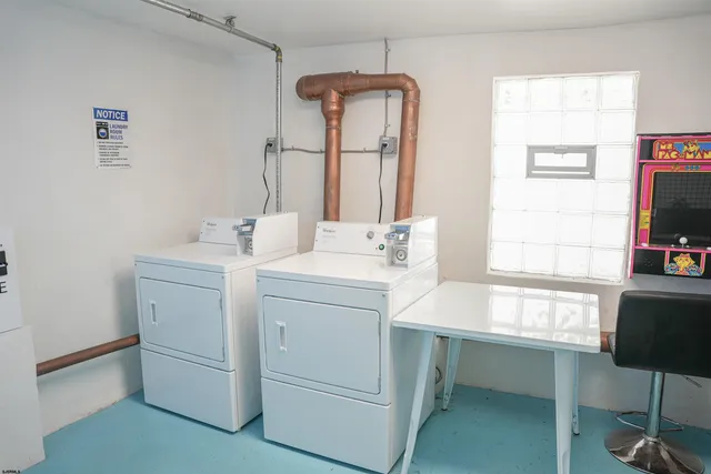 a room with a table chair and a window