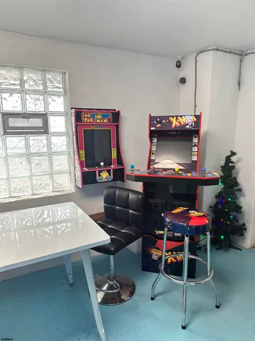 a reading room with furniture and a window