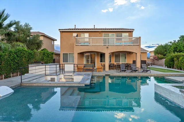 a front view of a house with swimming pool