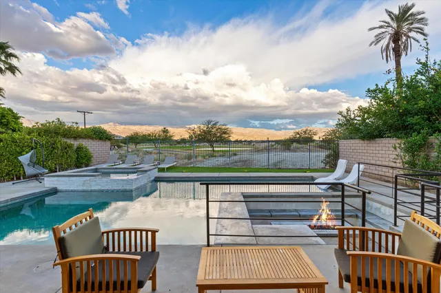 a view of a house with patio outdoor seating