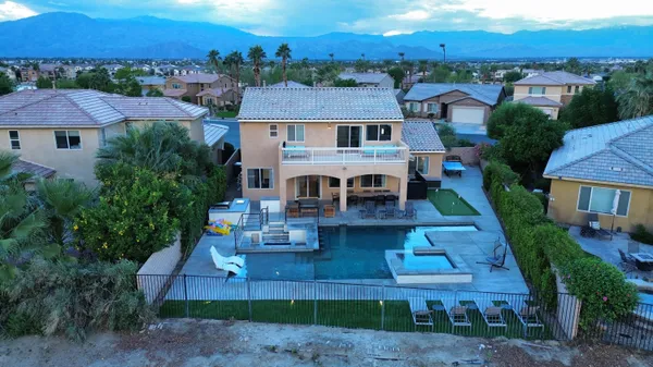 an aerial view of a house with a yard
