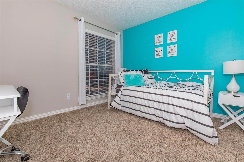 1826 Esters Road, Unit 1050 Irving, TX 75061 - Photo 15 of 39 Wall-to-wall carpeting with a neutral tone, window with blinds, and a two-tone wall finish