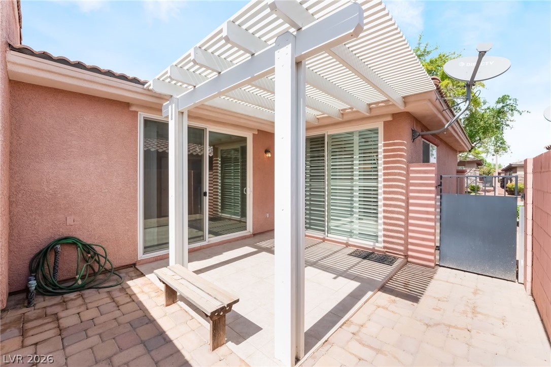 10481 Riverside Park Avenue Las Vegas, NV 89135 - Photo 34 of 51 View of patio / terrace with a gate and a pergola