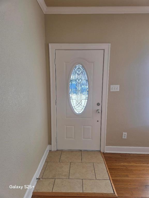 2849 West 12th Street Dallas, TX 75211 - Photo 3 of 14 a view of a livingroom with wooden floor and a white door