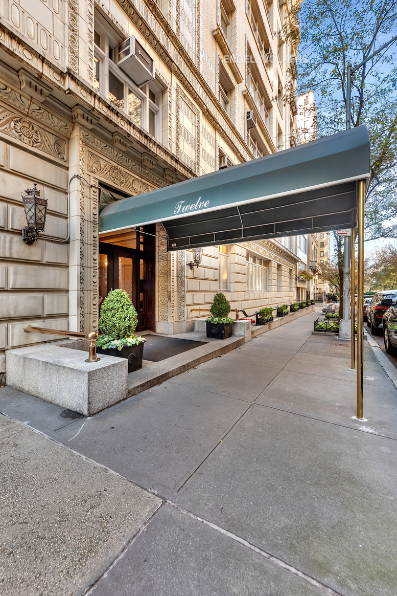 12 East 87th Street, Unit 8C Manhattan, NY 10028 - Photo 11 of 13 a view of a building along with the road and shops