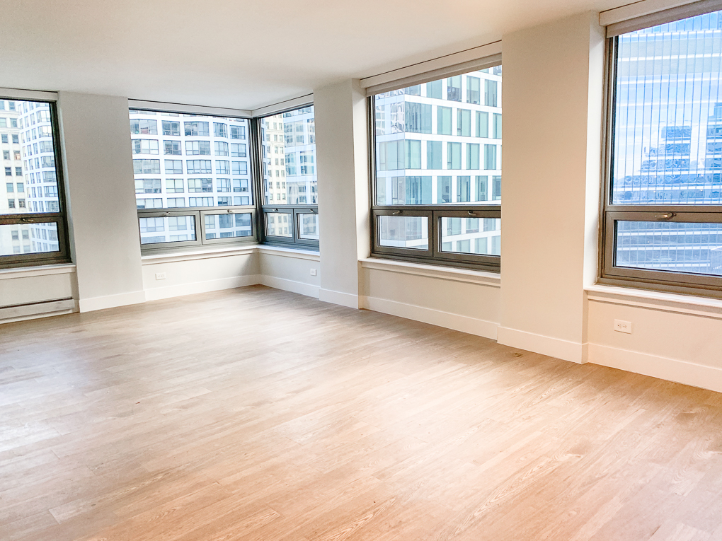 Undisclosed Address Chicago, IL 60611 - Photo 2 of 15 a view of an empty room with a window