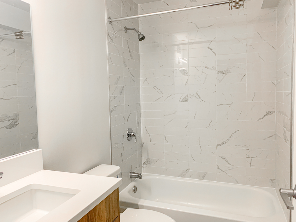 Undisclosed Address Chicago, IL 60611 - Photo 10 of 15 a bathroom with a sink and a bathtub