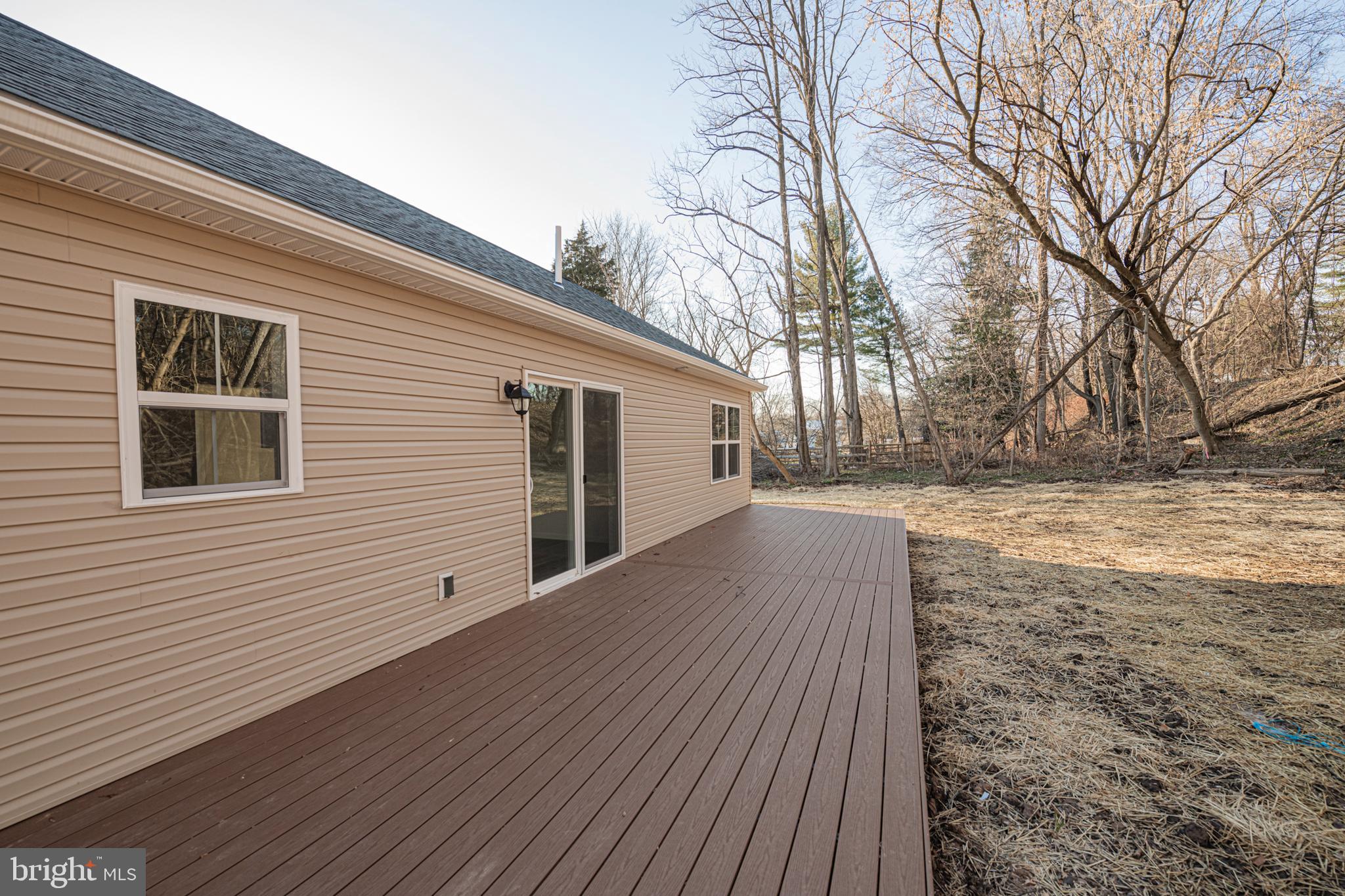 617 Port Providence Road Phoenixville, PA 19460 - Photo 4 of 25 a view of backyard with a large tree