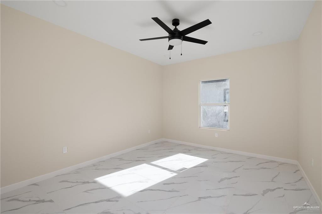 602 Mountain Road, Unit 12B Mission, TX 78573 - Photo 4 of 10 an empty room with a window