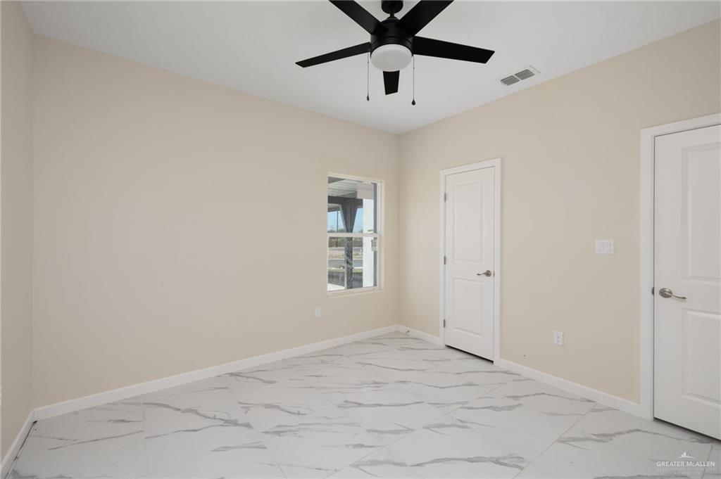 602 Mountain Road, Unit 12B Mission, TX 78573 - Photo 6 of 10 an empty room with fan and windows