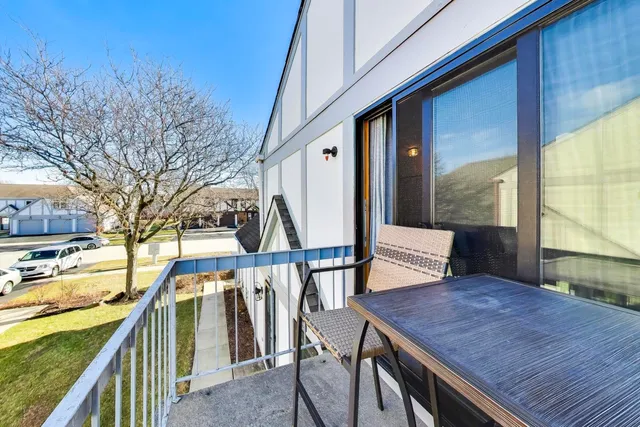 a view of a balcony with furniture
