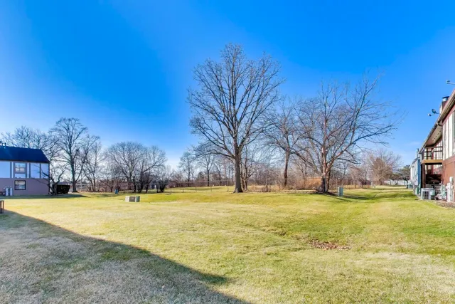 a view of a swimming pool with an outdoor space and seating area