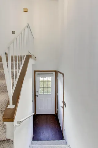 a view of an entryway with wooden floor