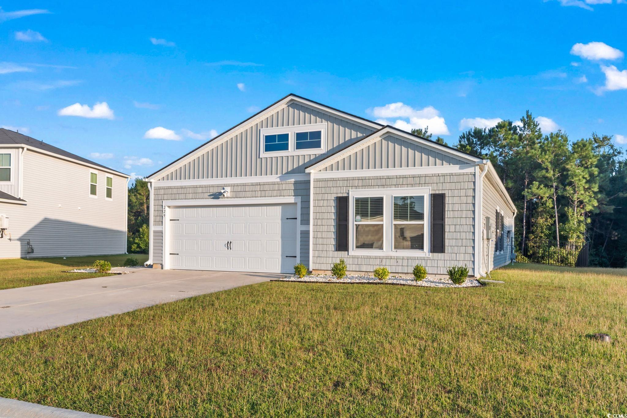 229 Cypress Tree Loop Longs, SC 29568 - Photo 1 of 40 View of front of property featuring a front yard