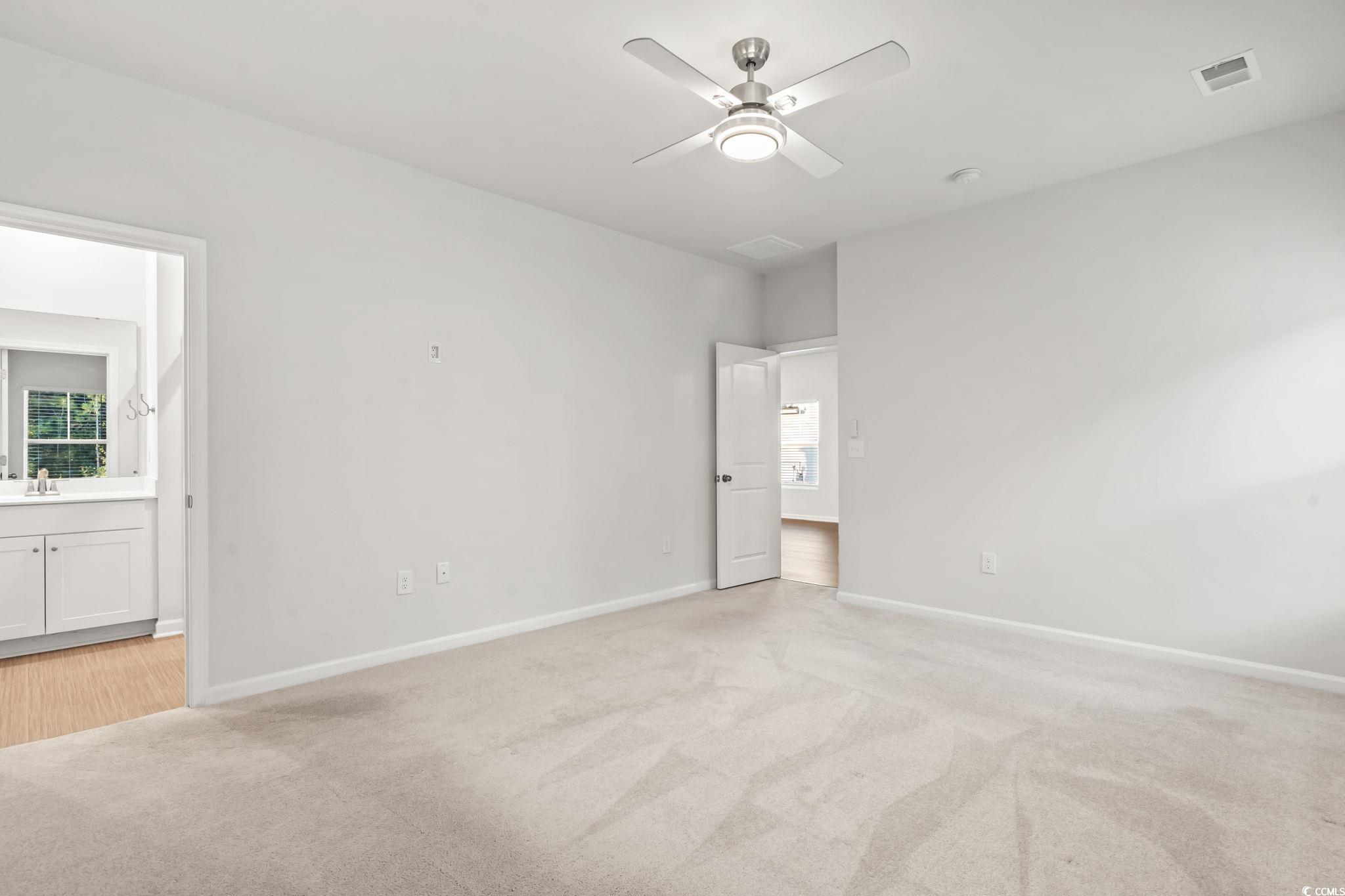 229 Cypress Tree Loop Longs, SC 29568 - Photo 20 of 40 Unfurnished bedroom featuring ceiling fan, sink, a