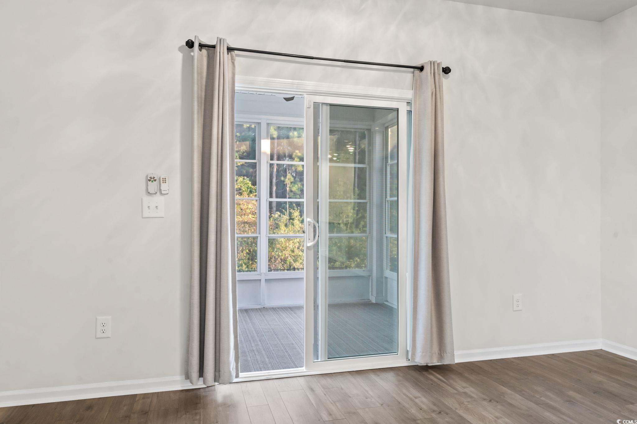 229 Cypress Tree Loop Longs, SC 29568 - Photo 25 of 40 Doorway to outside with hardwood / wood-style floo
