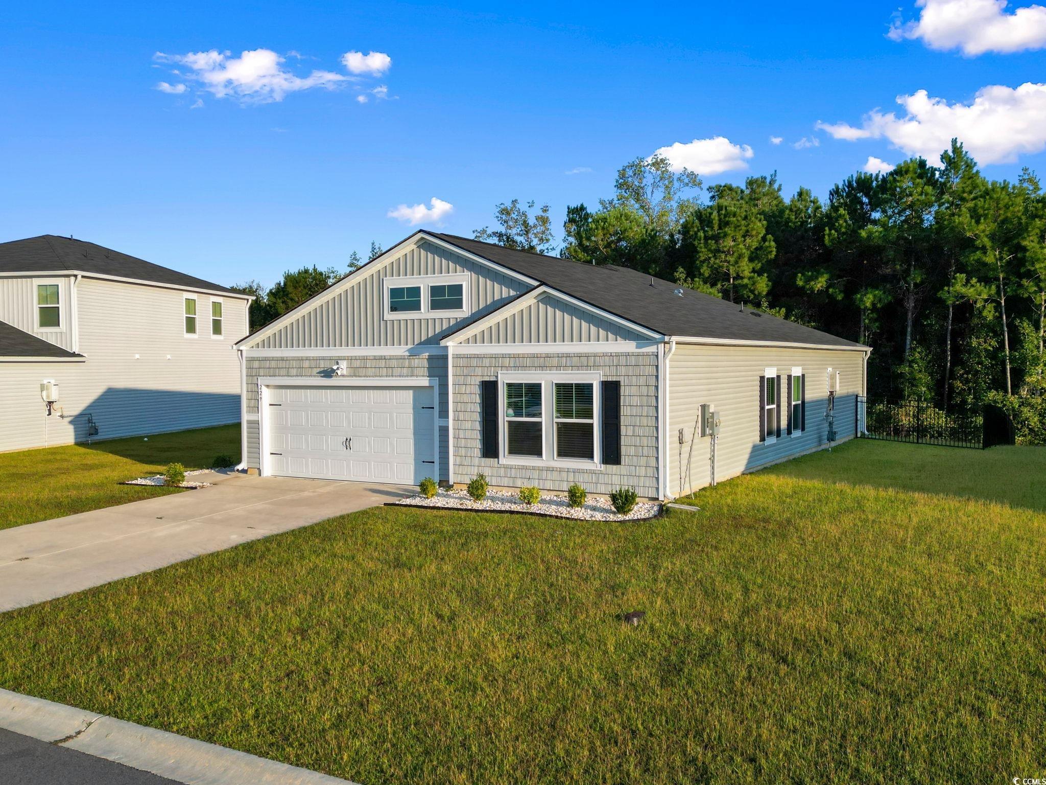 229 Cypress Tree Loop Longs, SC 29568 - Photo 35 of 40 View of front facade featuring a front yard